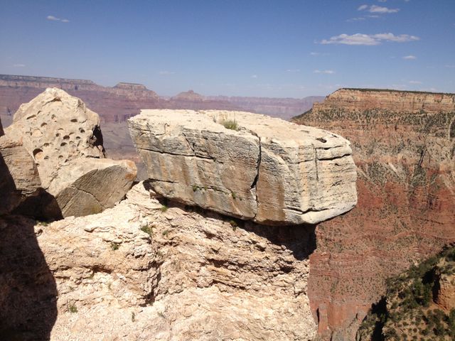 Perfect for promoting travel and outdoor adventures, this image showcases the breathtaking beauty and unique geological formations of the Grand Canyon under a clear blue sky. Ideal for use in travel brochures, nature documentaries, websites, and social media posts that highlight natural wonders and outdoor recreation.