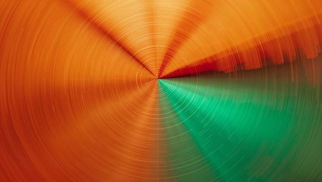 Abstract Radial Grooves Converging on Vibrant Orange and Teal