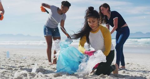 Diverse Female Volunteers Cleaning Beach for Eco Conservation