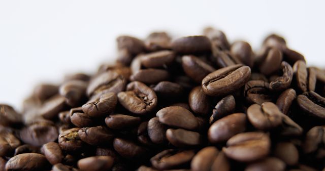 Close-Up of Freshly Roasted Coffee Beans on White Background - Download Free Stock Images Pikwizard.com
