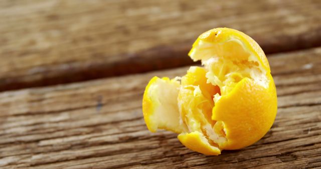 Yellow Citrus Fruit Showing Juicy Interior on Wooden Background - Download Free Stock Images Pikwizard.com
