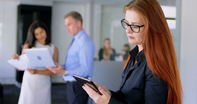 Senior Businesswoman with Digital Tablet in Modern Office - Download Free Stock Images Pikwizard.com