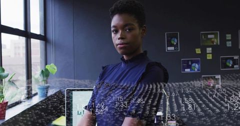 Confident Businesswoman Posing in Modern Office with Tech Overlay