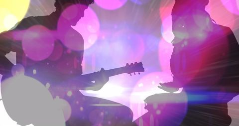 Silhouetted Musicians in Vibrant Abstract Light Display