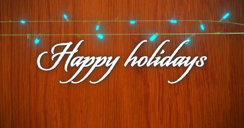 happy holidays text with fairy lights on wooden background - Download Free Stock Images Pikwizard.com