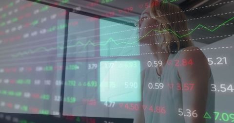 Businesswoman Analyzing Digital Finance Data in Modern Office