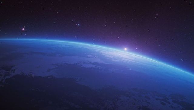View of Sunrise on Yonder Planet Horizon with Ocean in Space