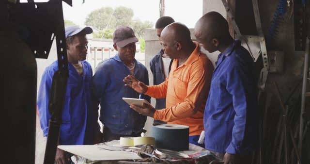 Foreman Leading Worker Team with Digital Tablet in Workshop - Download Free Stock Images Pikwizard.com