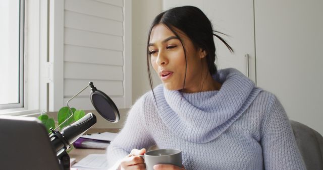 Young Woman Hosting Podcast at Home with a Microphone and Laptop - Download Free Stock Images Pikwizard.com