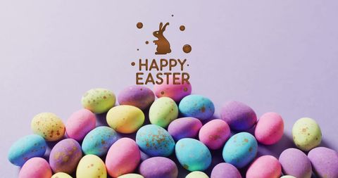 Colorful easter eggs with happy easter text on vibrant background