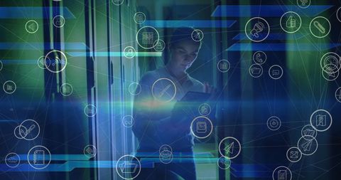Female technician managing digital network in high-tech server room