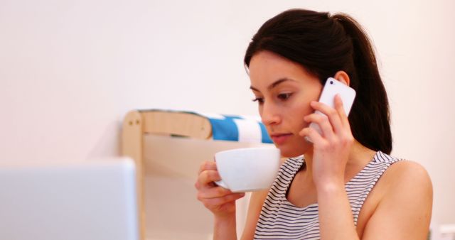 Woman Multitasking with Smartphone and Laptop While Drinking Coffee - Download Free Stock Images Pikwizard.com