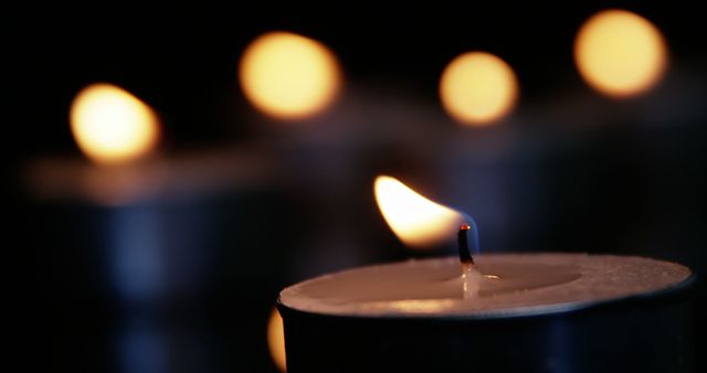 Close-Up of Burning Tealight Candles in Dark - Download Free Stock Images Pikwizard.com