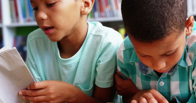 Two Children Reading Books in Library Environment - Download Free Stock Images Pikwizard.com