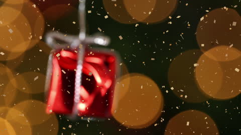 Festive Christmas Gift Box Dangling with Falling Confetti