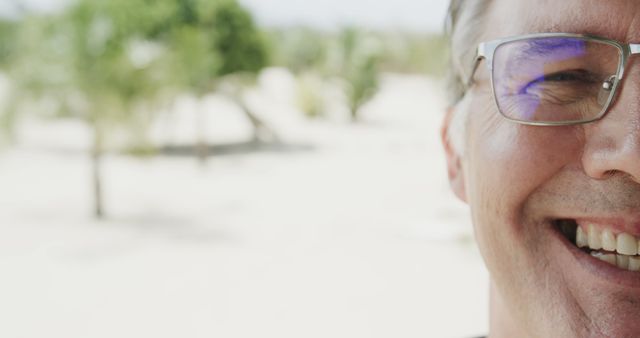 Man Smiling Outdoors in Bright Sunlight - Download Free Stock Images Pikwizard.com