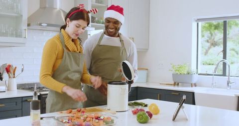 Festive Couple Preparing Meal at Upscale Kitchen
