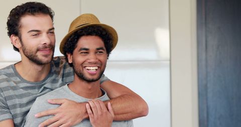 Two Friends Smiling and Embracing with Joyful Expressions