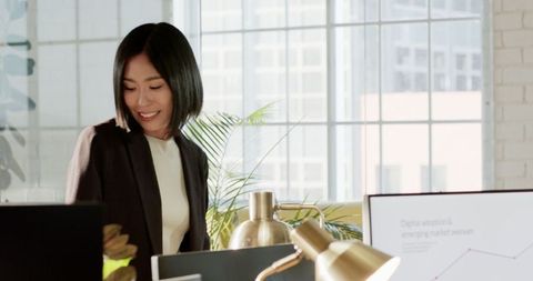 Business Professional Analyzing Digital Market Data in Modern Office