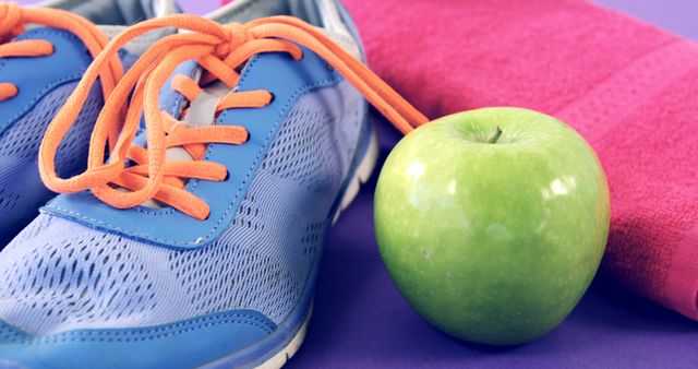 Healthy Lifestyle Concept with Sneakers, Green Apple, and Towel - Download Free Stock Images Pikwizard.com