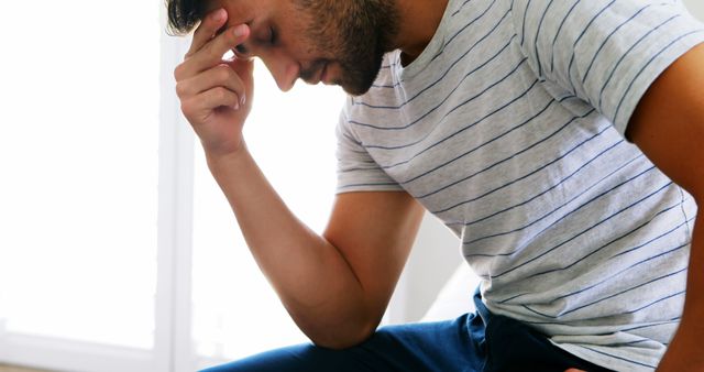 Man Resting Head on Hand Deep in Thought - Download Free Stock Images Pikwizard.com