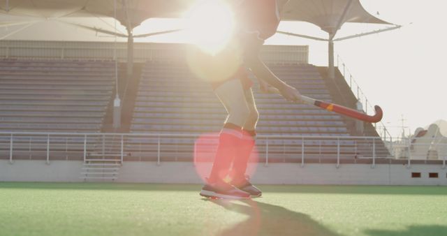 Field Hockey Player Practicing on Sunny Day at Empty Stadium - Download Free Stock Images Pikwizard.com