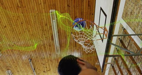 Dynamic Basketball Shot with Digital Motion Trail in Gym