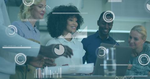 Diverse team analyzing data with holographic overlay in modern office