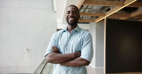 Confident african american professional standing in office with smile