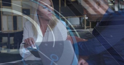 Business Team Reviewing Data with Digital HUD Overlay in Modern Coworking Workspace