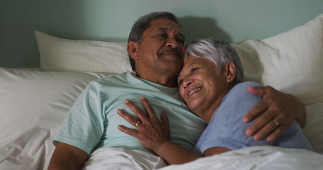 Happy Senior Couple Cuddling in Bed - Download Free Stock Images Pikwizard.com