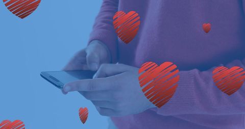 Young Man Engaging with Smartphone Amid Floating Hearts