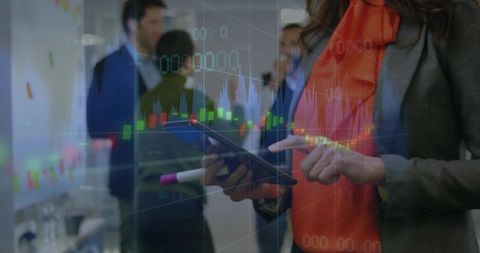 Businesswoman Analyzing Stock Market Data on Tablet in Modern Office