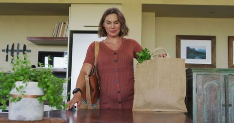 Pregnant Woman Returns with Eco-Friendly Grocery Bag