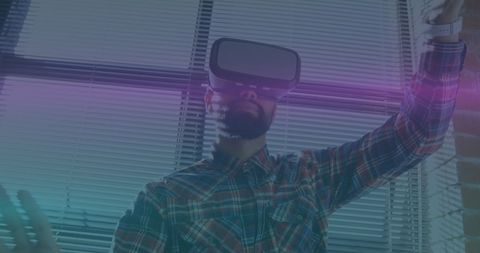 Man Experiencing Virtual Reality in Office with Futuristic Light Trails