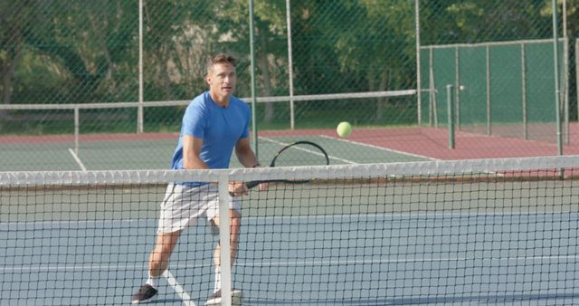 Athletic Man Playing Tennis On Outdoor Court - Download Free Stock Images Pikwizard.com