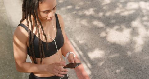 Woman Listening to Music with Earphones Outdoors - Download Free Stock Images Pikwizard.com