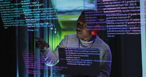 Engineer Analyzing Data with Code Overlay in Server Room - Download Free Stock Images Pikwizard.com