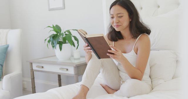 Young Woman Reading Book in Cozy Bedroom - Download Free Stock Images Pikwizard.com