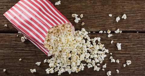 Freshly Popped Popcorn in Striped Box on Rustic Wooden Table - Download Free Stock Images Pikwizard.com