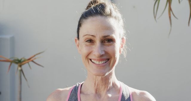 Smiling Mature Woman in Activewear Enjoying Outdoor Exercise - Download Free Stock Images Pikwizard.com