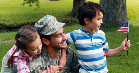 Joyful Military Father Bonding with Children Outdoors - Download Free Stock Images Pikwizard.com