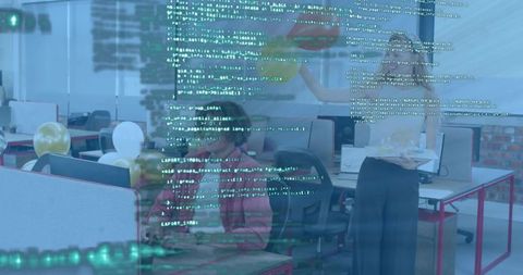 Male developer coding on laptop in open office with code overlay and balloons