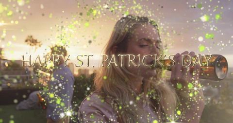 St. Patrick's day rooftop party woman sipping beer at sunset with green confetti