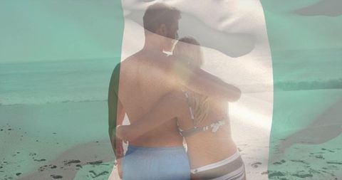 Couple embracing on tropical beach through sheer fabric veil double exposure romance