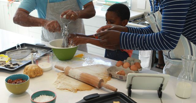 Family Baking Together in Kitchen Wearing Aprons and Mixing Ingredients - Download Free Stock Images Pikwizard.com