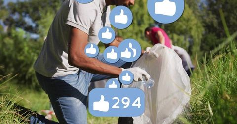 Community volunteers picking up litter in sunny park collecting plastic bottles for cleanup