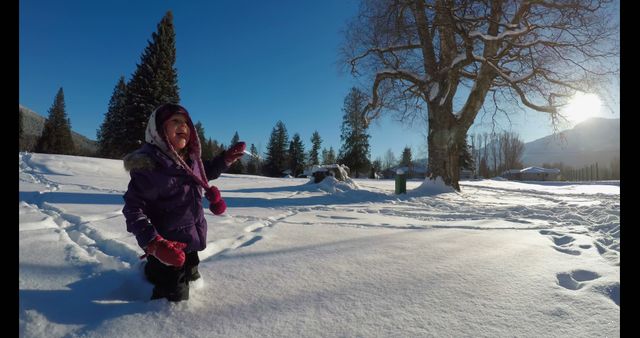 Joyful Child Playing in Snowy Winter Landscape - Download Free Stock Photos Pikwizard.com