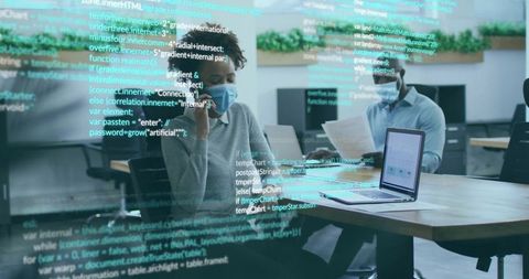 Software developers analyzing code on transparent screen