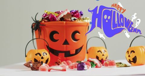 Halloween Candy Buckets with Pumpkin Faces on White Table - Download Free Stock Images Pikwizard.com